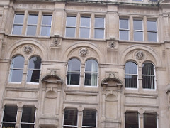 Gazette Buildings, Corporation Street - three heads each