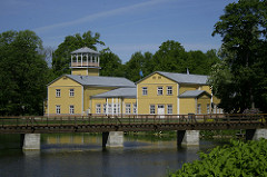 Bridge with wooden building in background