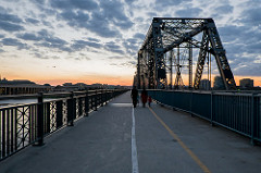 Family walking along Alexandra Bridge